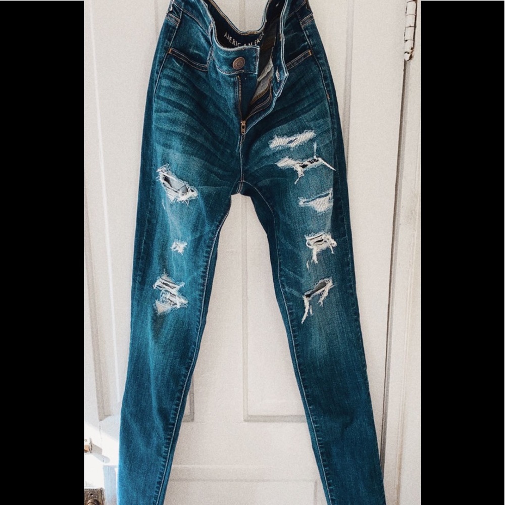 Dark wash distressed denim skinny jeans